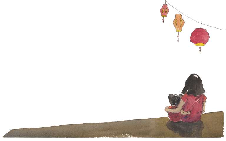 image of two girls sitting under lanterns