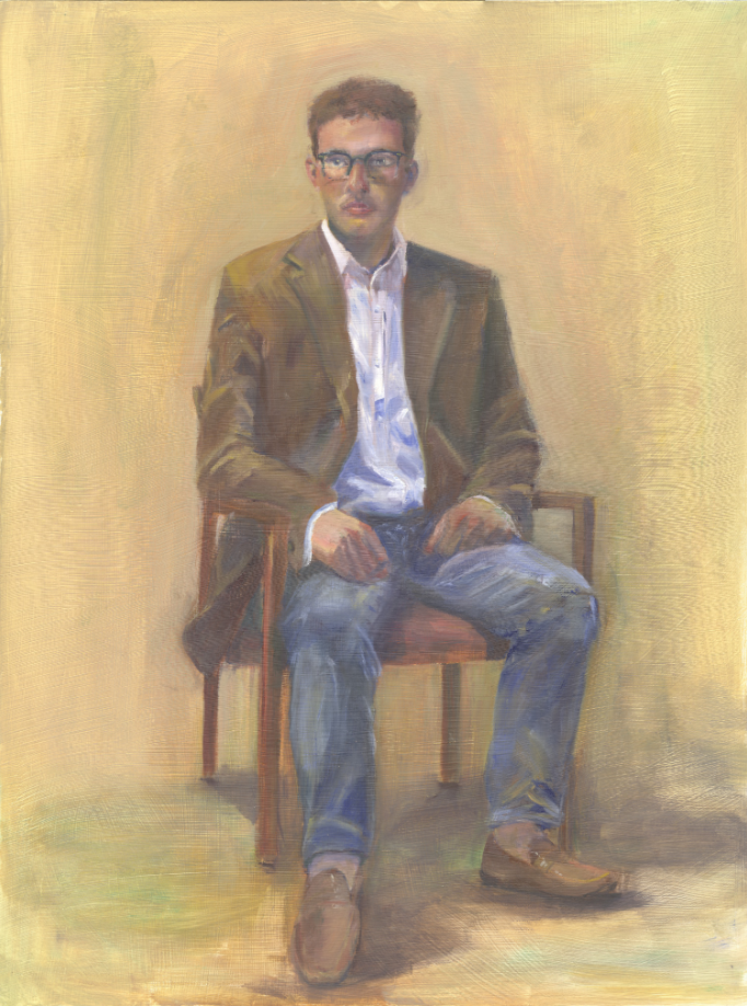 Portrait of a man sitting in a chair.
