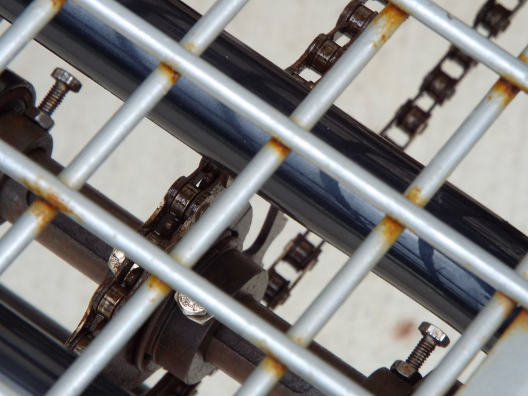 Close cropped picture of a bicycle chain.